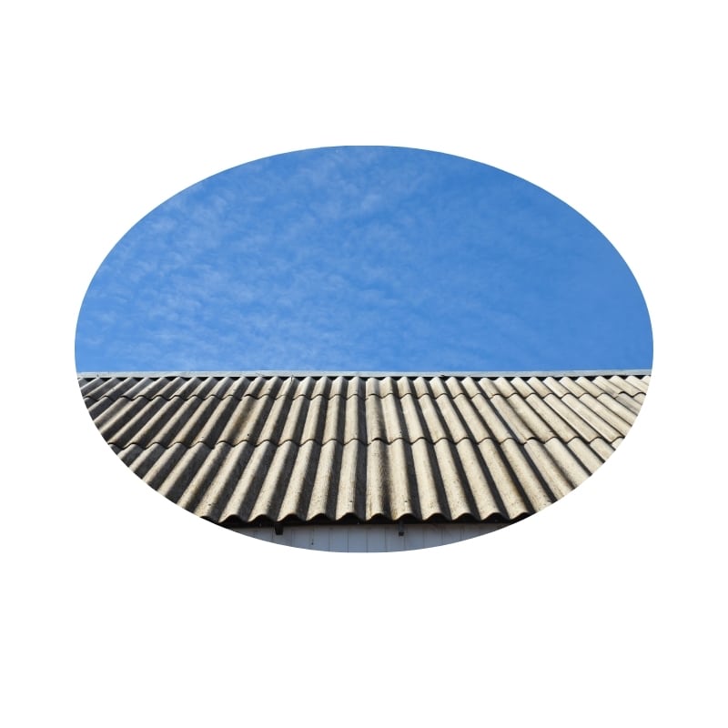 Asbestos removal Gosford: A close-up of an asbestos roof against a blue sky.