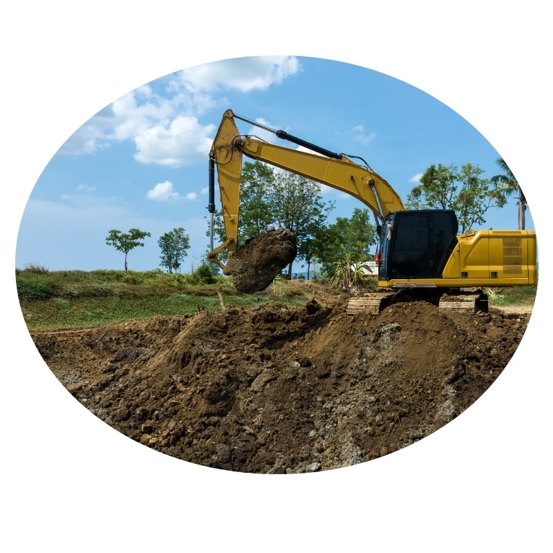 Excavation contractor operating a backhoe to dig a hole near Lake Macquarie.