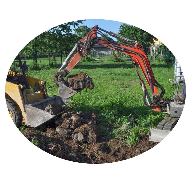 Excavation Gosford: A mini-excavator digging a hole in a residential backyard.