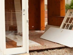 a house being demolished with the walls and window in the floor