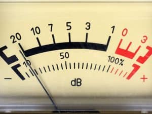 The sound level meter shows high decibels, indicating potential demolition noise.