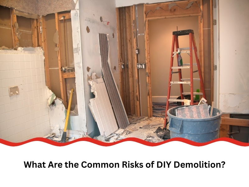 A partially demolished bathroom shows the risks of DIY demolition, with exposed studs, debris, and a ladder present.