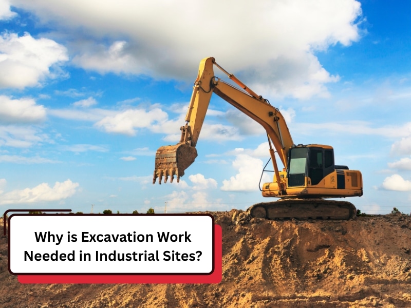 A yellow excavator sits on a dirt mound under a cloudy sky, illustrating why excavation work needed on industrial sites.