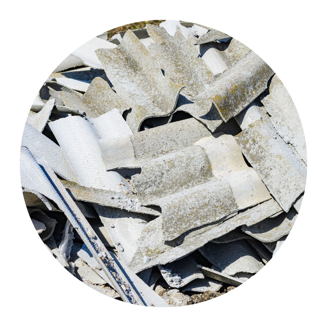 Pile of broken asbestos cement roofing sheets.