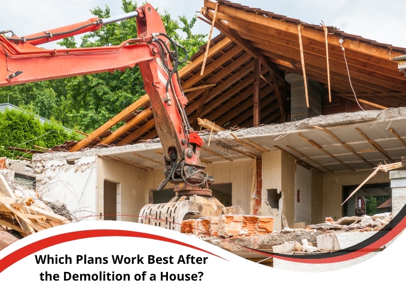 Excavator in action during the demolition of a house with timber roof collapse.