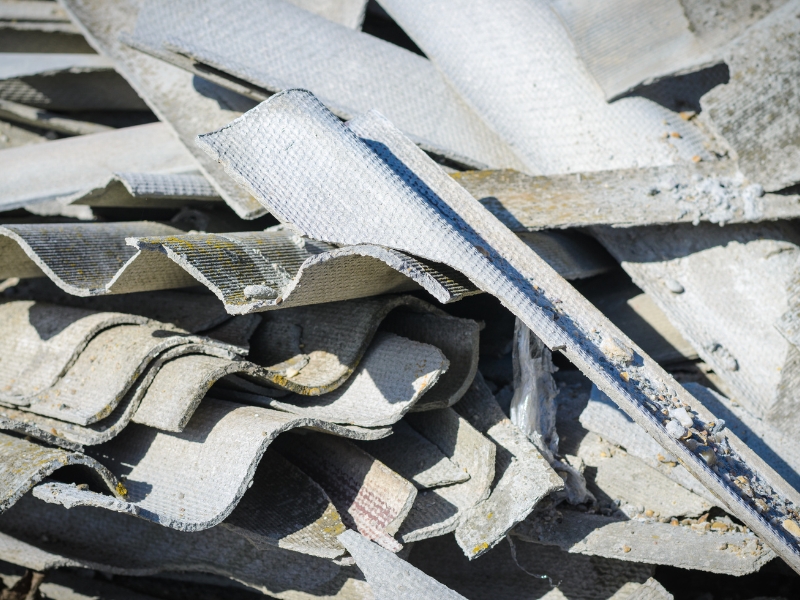 Damaged asbestos sheets ready for safe getting rid of asbestos process.