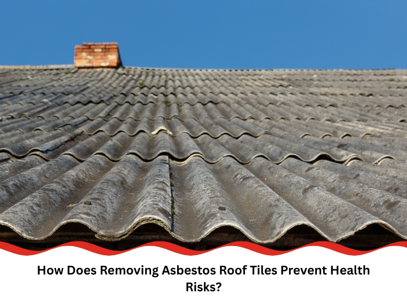 Weathered asbestos roof tiles on a house under clear blue sky, showing need for safe removal.
